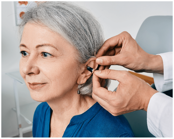 woman getting fitted for a hearing aid